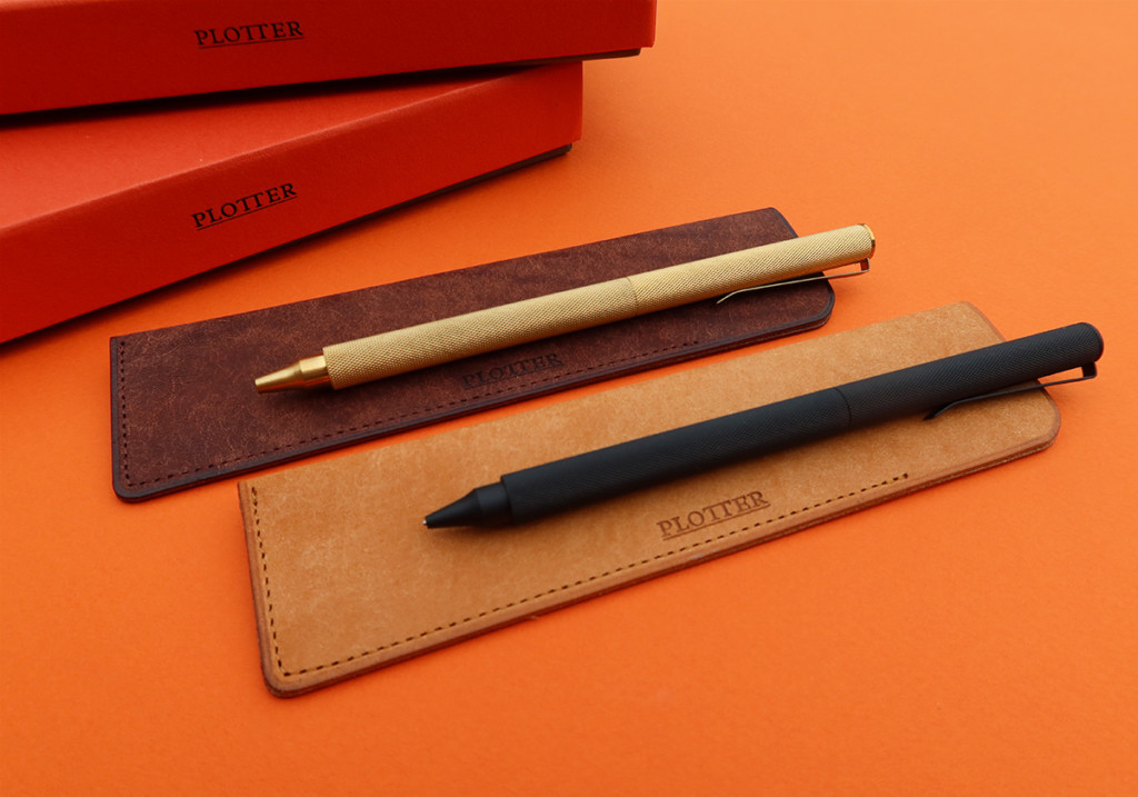 PLOTTER pens and pencils on top of a PLOTTER leather