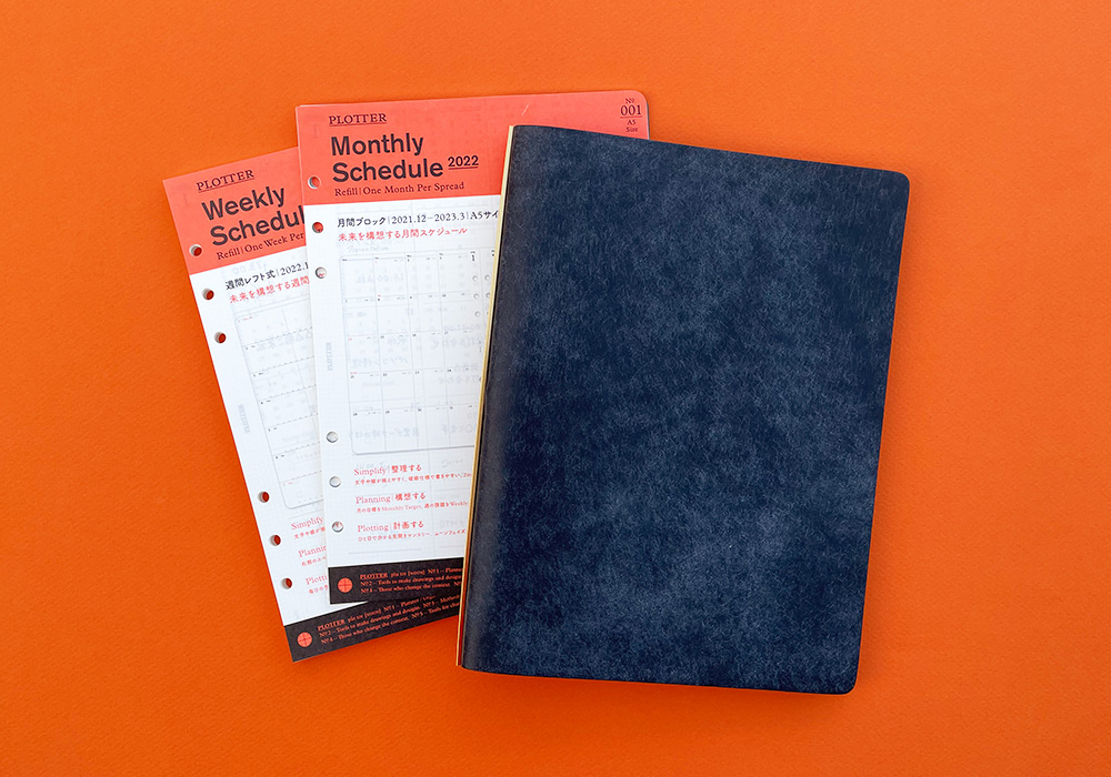 An A5 Size PLOTTER beside the Monthly and Weekly Schedule refills for PLOTTER Leather Binders.