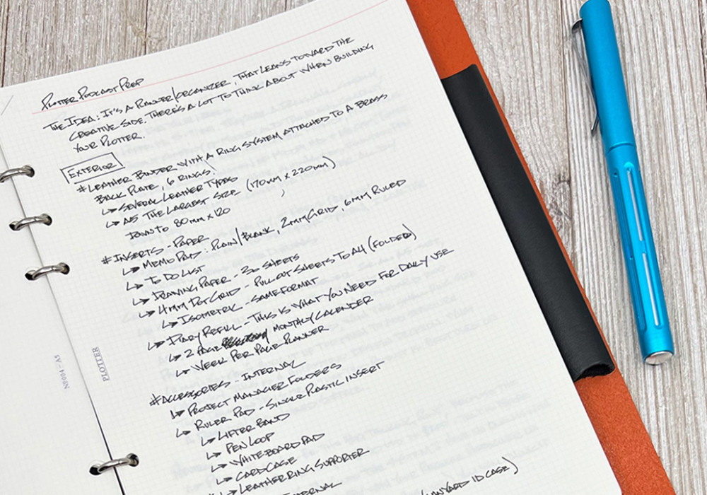 Close-up of brainstorming notes on PLOTTER 2mm Grid Refill for A5 Size.