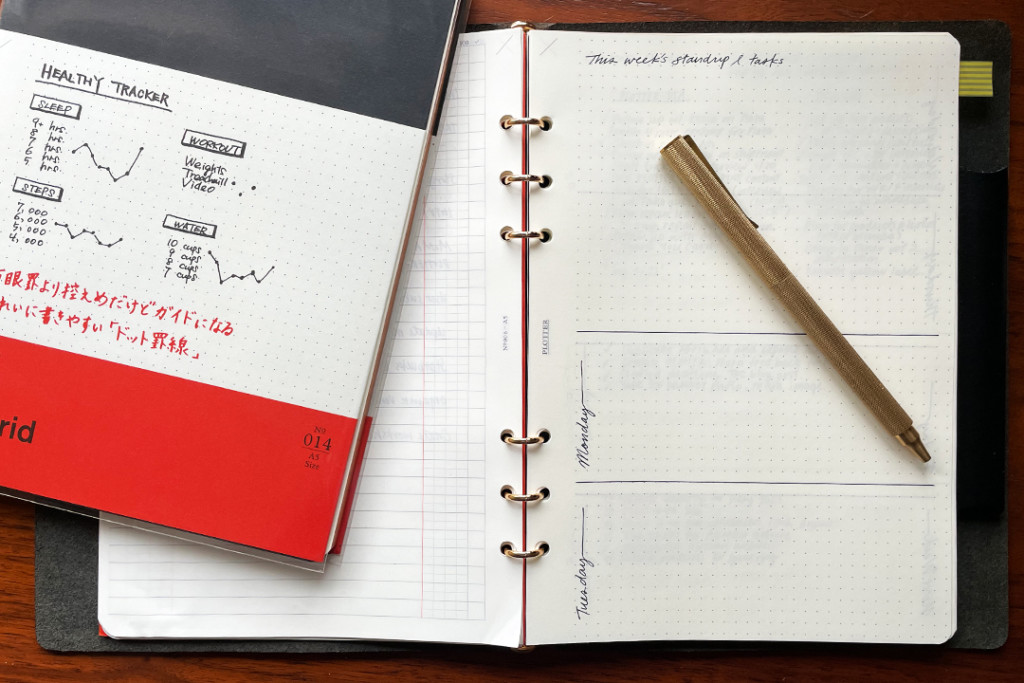 PLOTTER A5 Dot Grid Notepad with leather binder and brass pen.