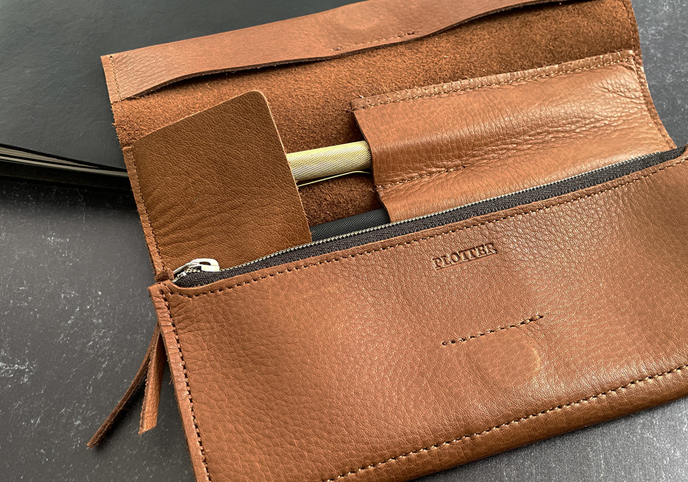 A PLOTTER roll pen case half folded over.