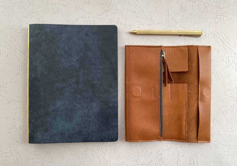 A PLOTTER Roll Pen Case next to a PLOTTER in A5 Size.