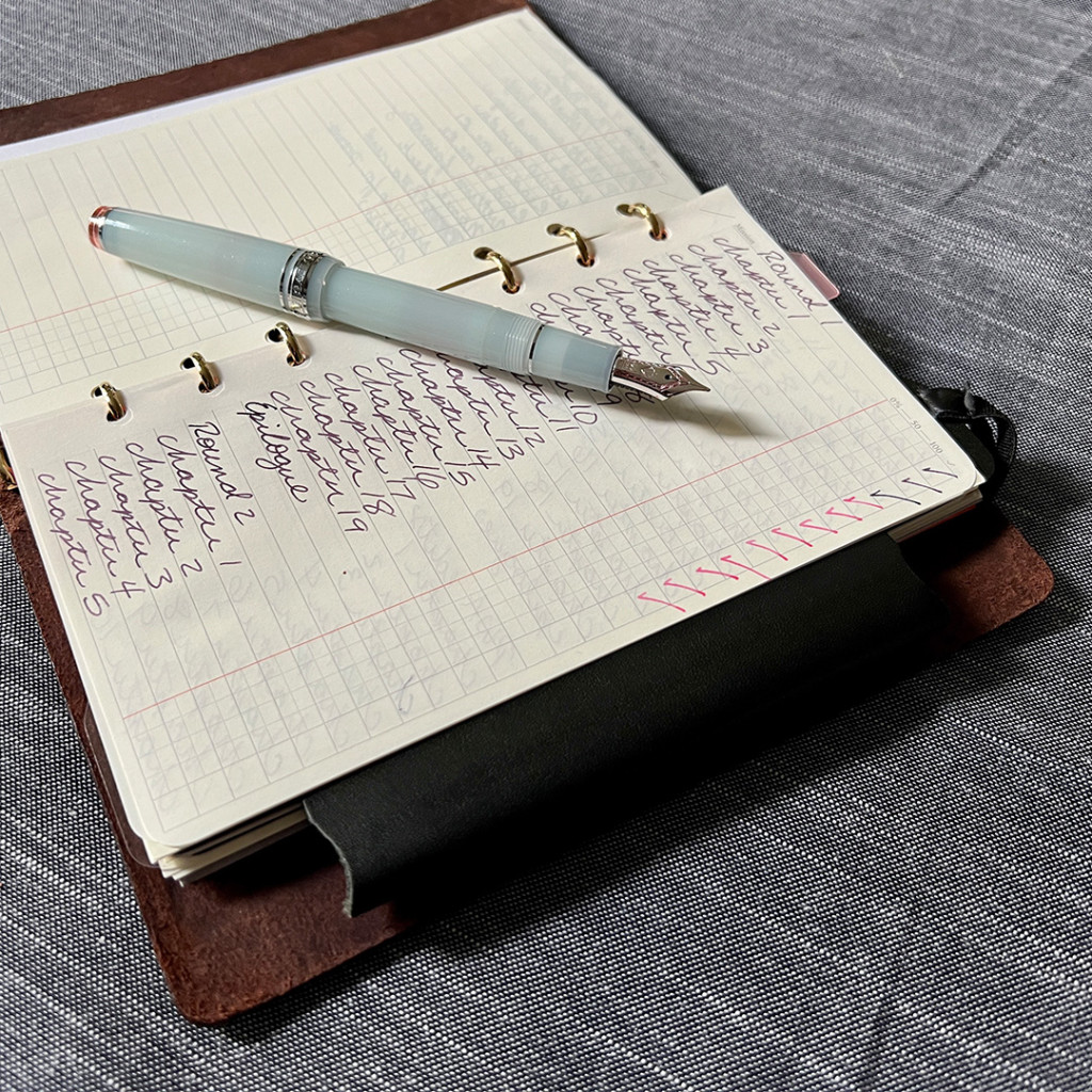 A usage example of PLOTTER Refill Memo Pad To Do List with a fountain pen next to it.