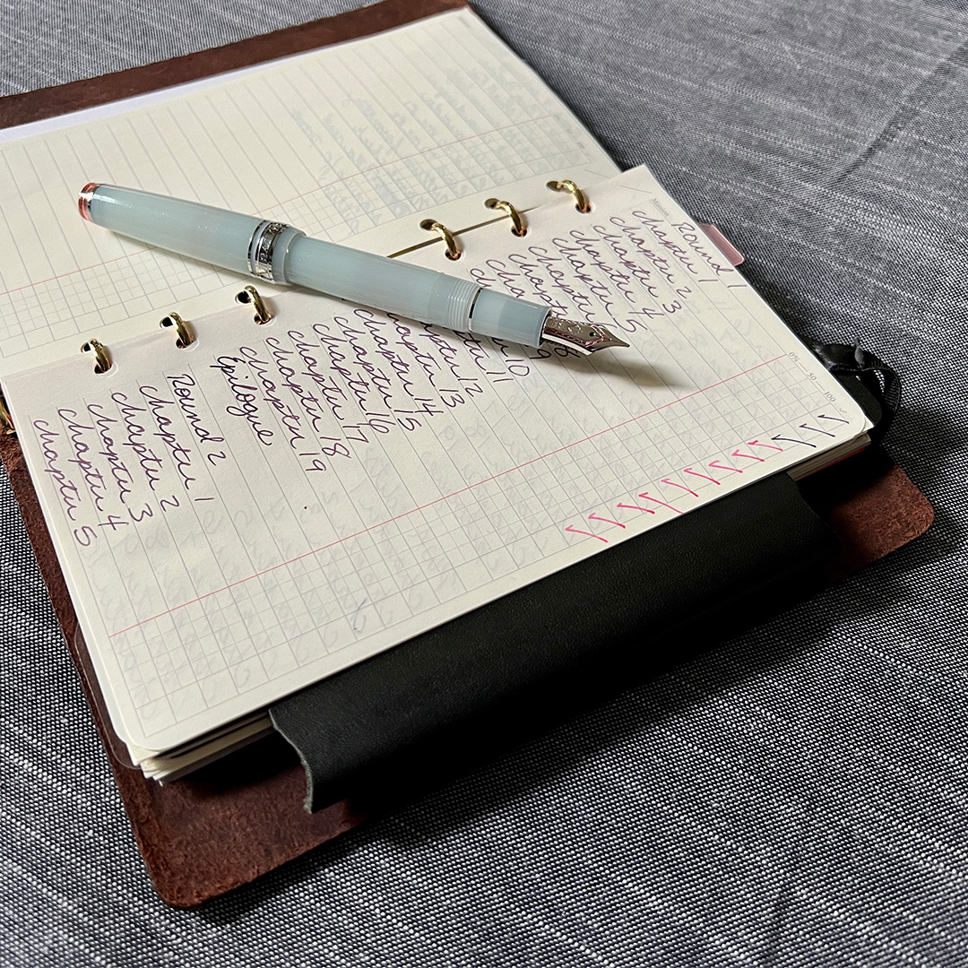 A usage example of PLOTTER Refill Memo Pad To Do List with a fountain pen next to it.