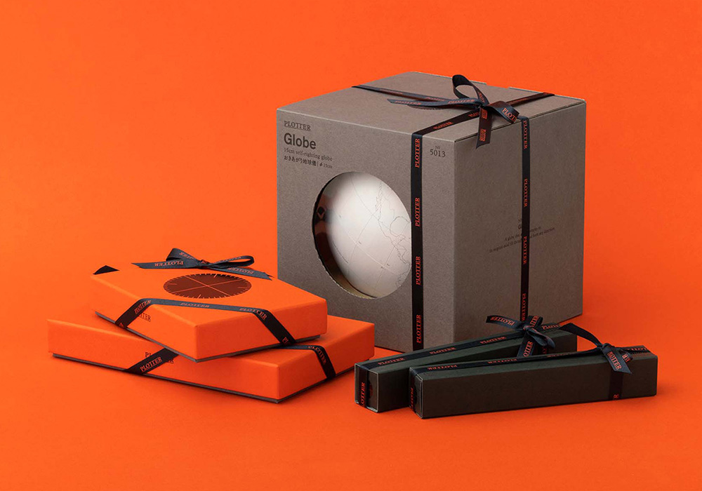 Special gift wrapping on PLOTTER Leather Binders, pens, and globe.