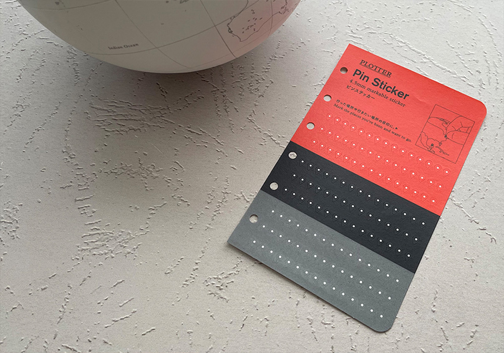 A special Pin Sticker that comes with each globe.