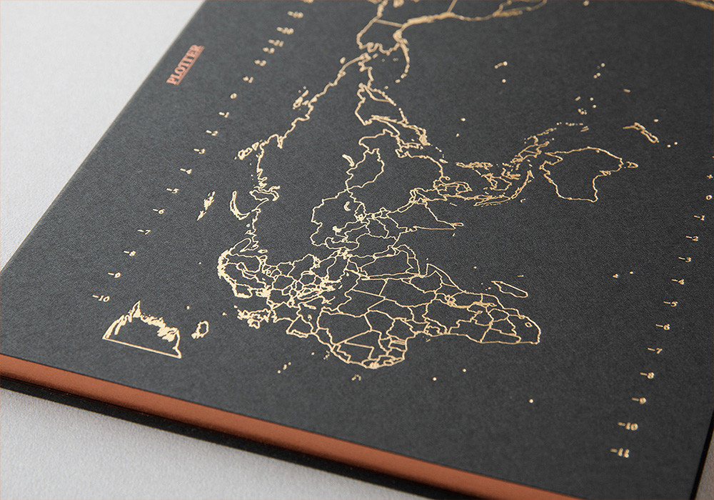 A close up of the letterpress foil stamping on a PLOTTER Notepad.