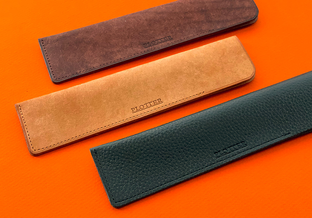 Three special leather pen sleeves.