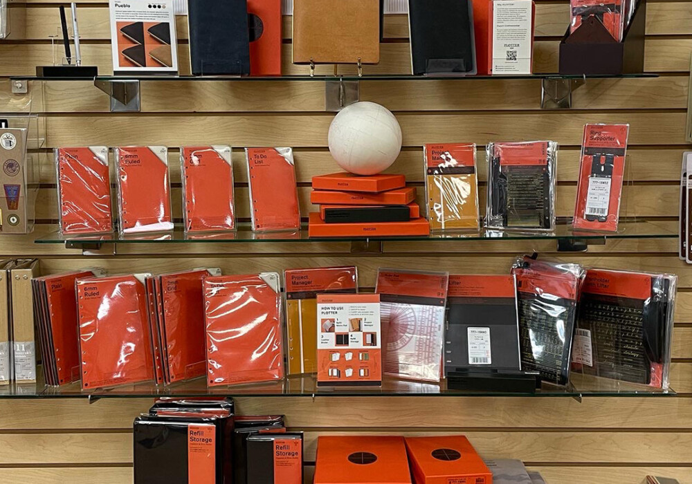 A wall display featuring PLOTTER products.