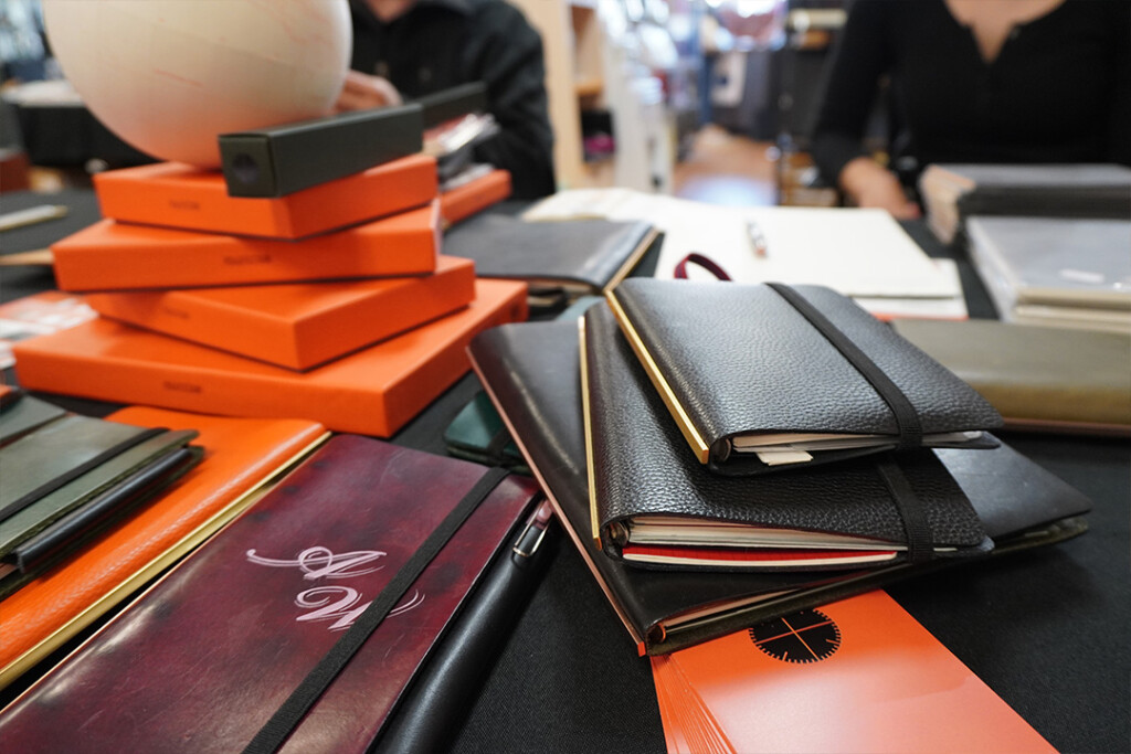 A close up of PLOTTER Leather binders in a variety of sizes.
