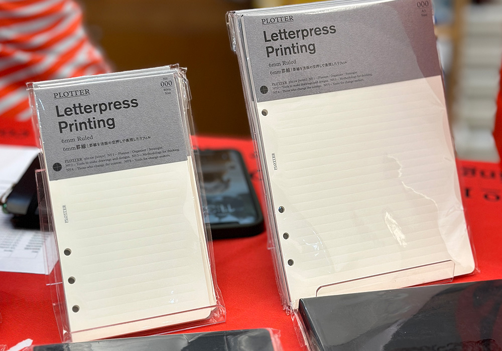 PLOTTER event limited Letterpress refills in A5 and Bible Size displayed inside the store.