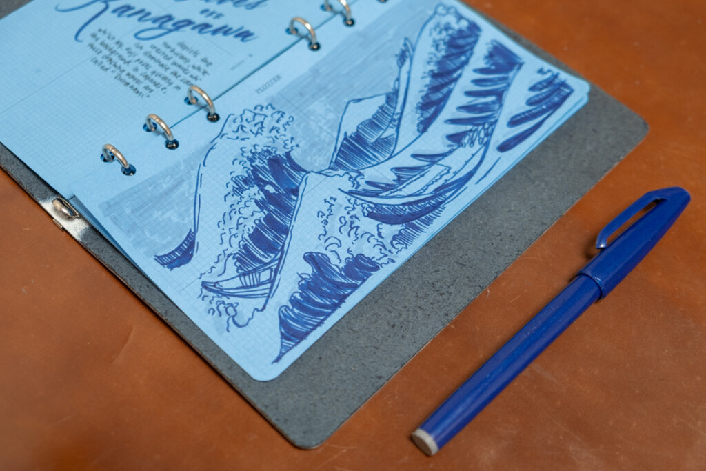 A sketch of giant waves on Blue Paper in Bible Size.