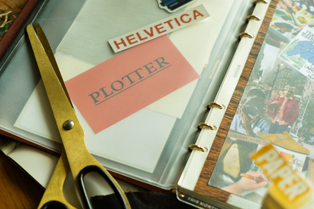 A collage vision board inside a PLOTTER Leather Binder.