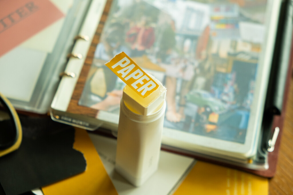 Collage elements from a magazine on top of a glue stick.