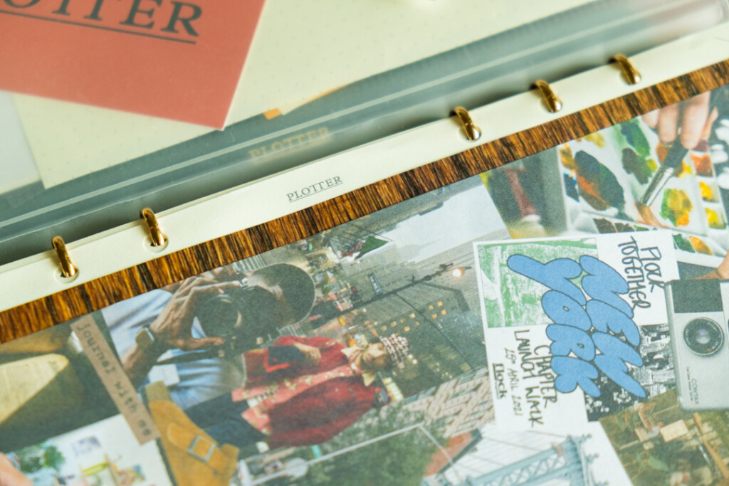 A close-up of a collage vision board inside a PLOTTER Leather Binder.