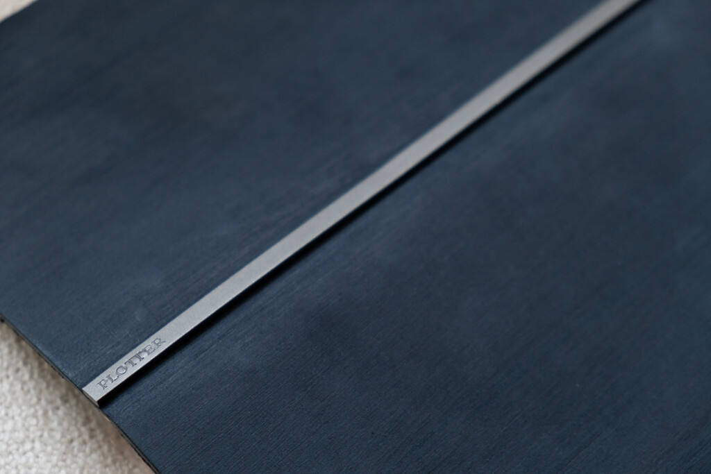 A close-up PLOTTER Horse Hair II Leather Binder in navy blue.