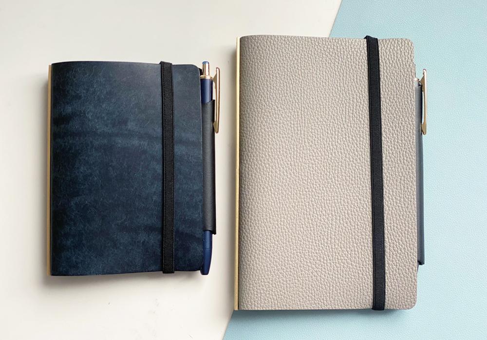 Navy Pueblo PLOTTER Leather Binder Mini Size beside Gray Shrink PLOTTER Leather Binder.