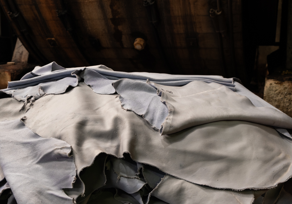 White leather resting in a pile in a leather tannery.