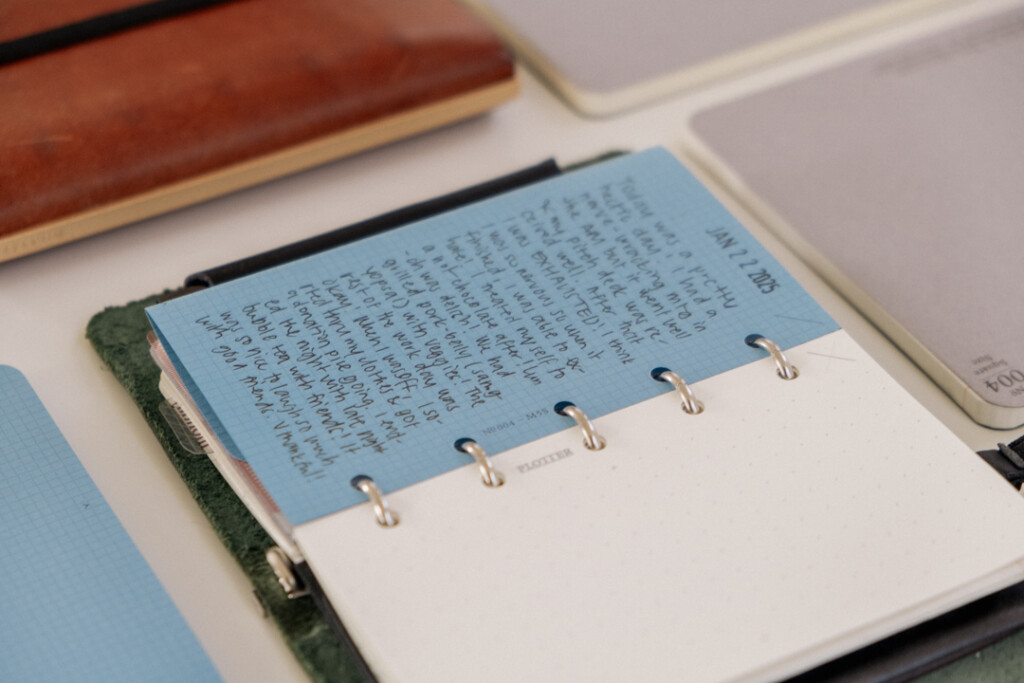 Mini 5 Square refills in Blue Paper folded to show that it fits into a PLOTTER Mini 5 Leather Binder.