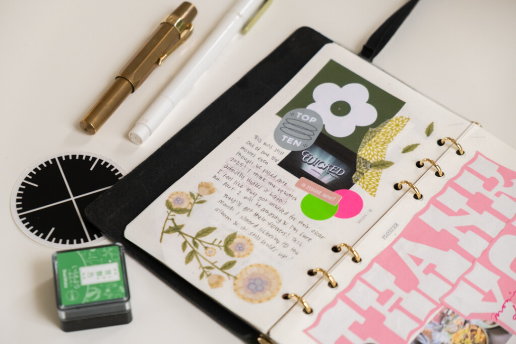 Close up of creative journal page about the Wicked Movie Musical in PLOTTER Leather Binder in the Bible Size.