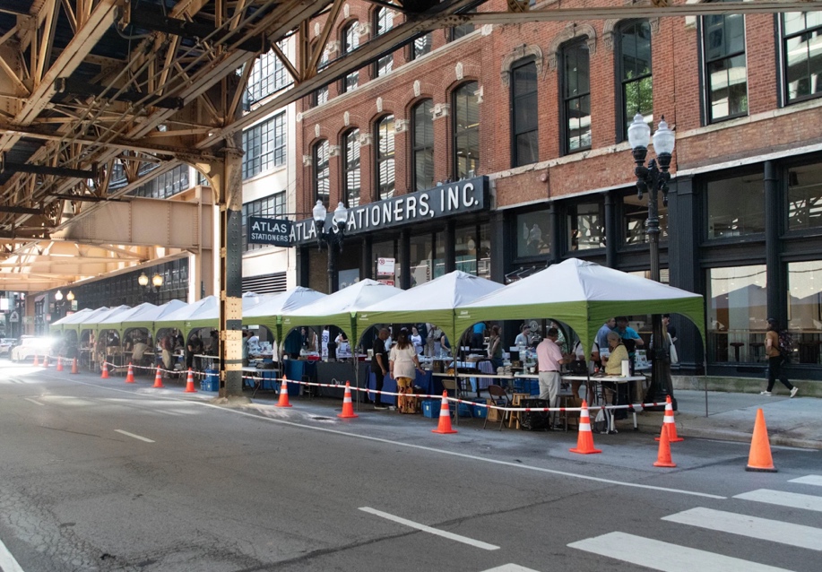 The exterior of Atlas Stationers during the Sidewalk sale. 