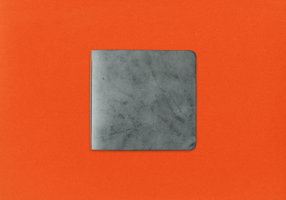 PLOTTER Shiranami Leather in Mini 5 Square Size against an orange background.
