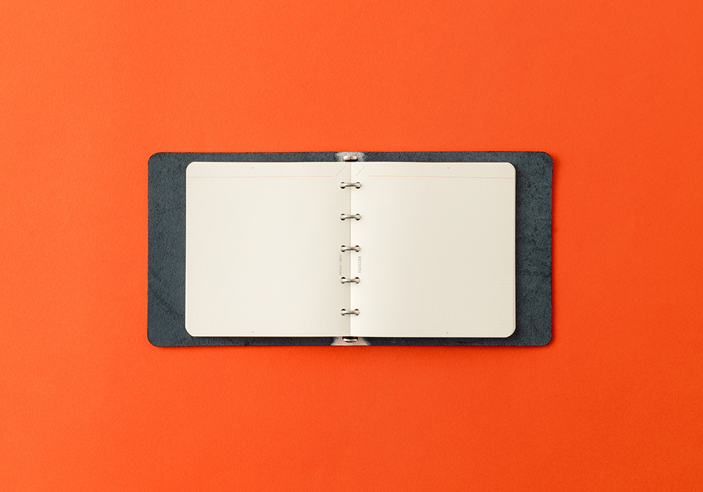 A Shiranami Leather Binder in Mini 5 Square Size opened fully.