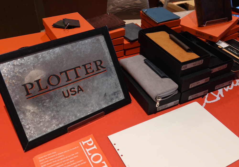 PLOTTER Long Pen Case and PLOTTER sign at the PLOTTER USA table at the SF Pen Show.