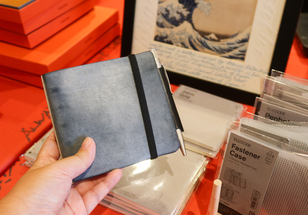 PLOTTER Leather Binder in Shiranami Square Size on the PLOTTER USA table at the SF Pen Show.
