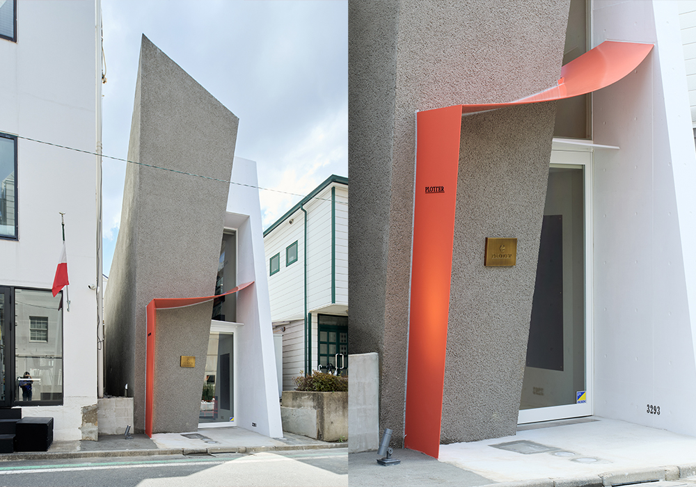 The exterior view of PLOTTER TOKYO Flagship store, resembling two leather binders leaning against each other.