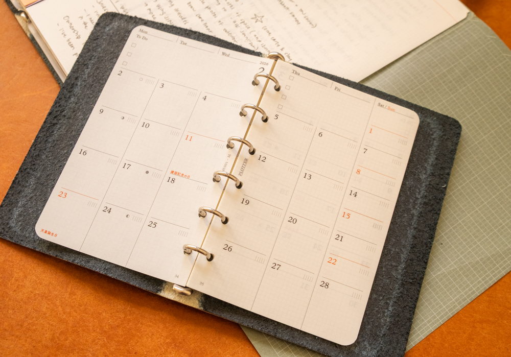 PLOTTER dated Diary 2026 refills in Monthly Schedule format inside PLOTTER Leather Binders in Mini Size.