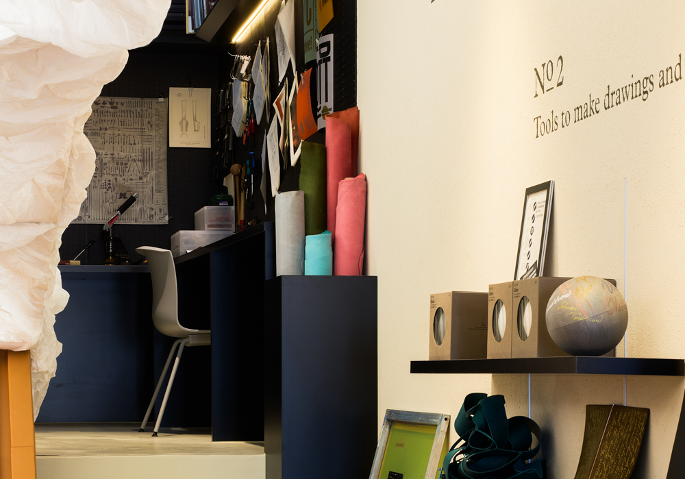 Inside of PLOTTER TOKYO flagship store with shelves filled with PLOTTER products.