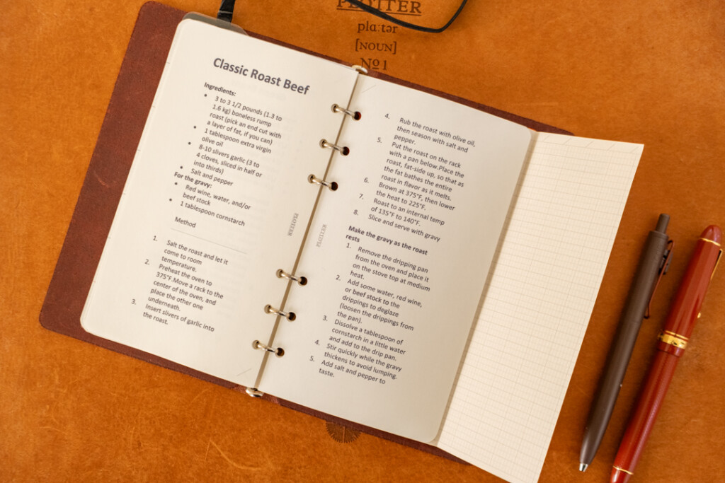 A PLOTTER Leather Binder open to a recipe for Roast Beef.