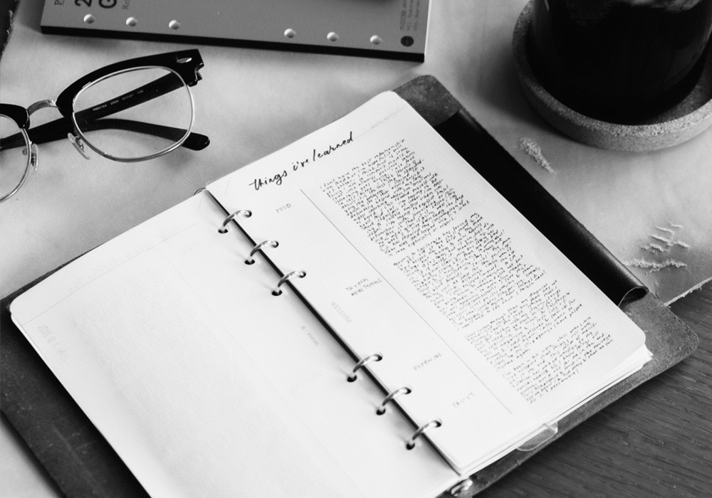 black and white image of a filled page in PLOTTER with reflection.