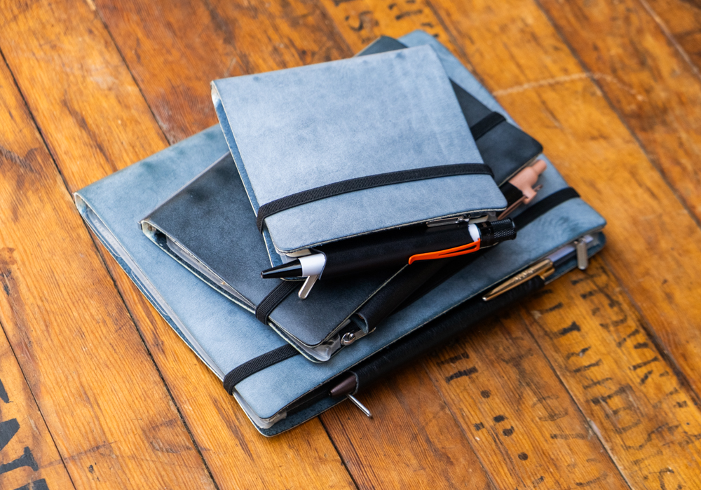 A stack of US Exclusive Shiranami Leather Binders on top of each other (Mini 5 Square Size, Bible Size, and A5 Size)