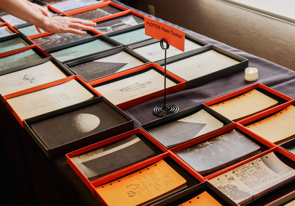 A table filled with different collage materials, papers, and ephemera.