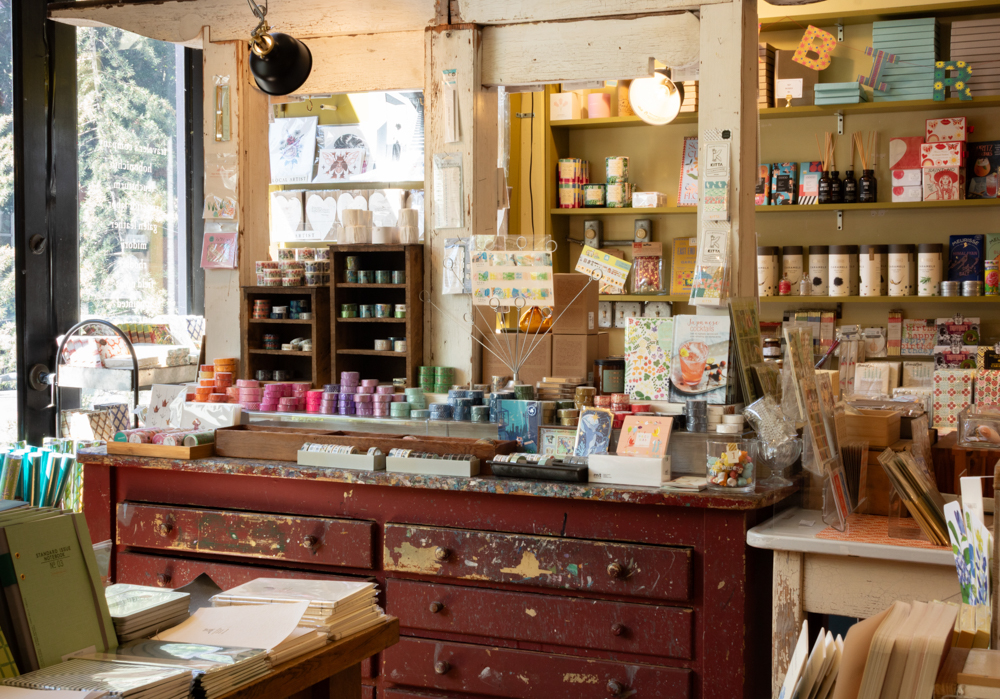 Interior of Oblation Papers and Press shop in Portland, Oregon, which is filled with stationery, paper goods, and writing instruments.