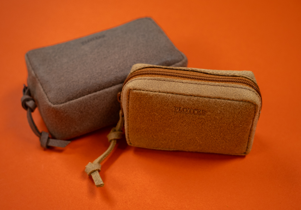 Gusseted pouches featuring genuine split leather.