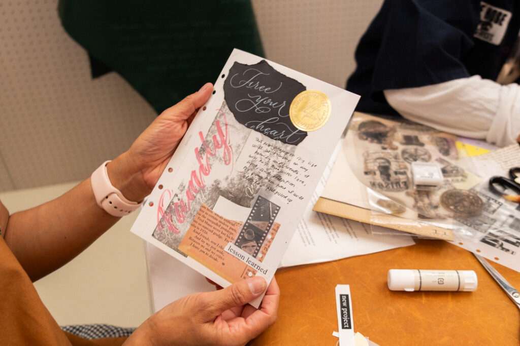 A person showing their completed collages during the PLOTTER TOKYO workshop, which takes place on the third floor of PLOTTER TOKYO.