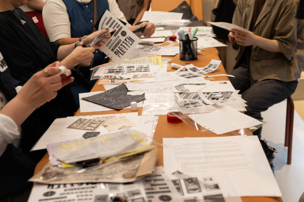 People collaging and doing calligraphy during the PLOTTER TOKYO workshop, which takes place on the third floor of PLOTTER TOKYO.