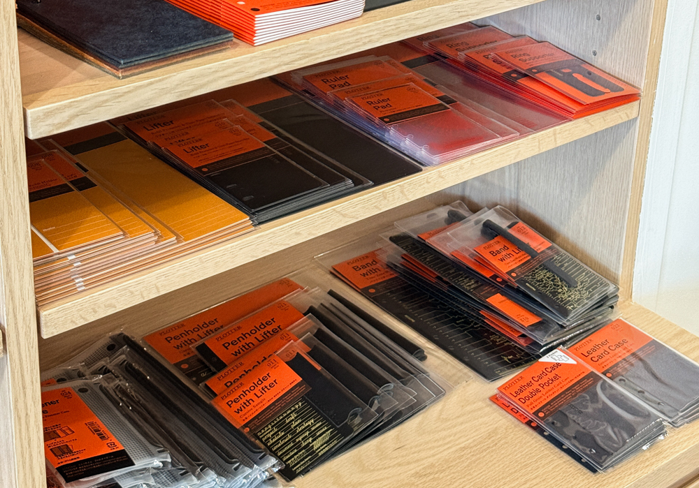 A view of the PLOTTER display in M.Lovewell in Santa Ana, California, which showcases PLOTTER Leather Binders, refills, and accessories.